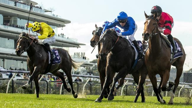 MELBOURNE, AUSTRALIA - JUNE 22: Daniel Stackhouse riding Sneaky Sunrise (r) defeats Blake Shinn riding Pisces in race 1, the Ken Cox Handicap - Betting Odds during Melbourne Racing at Flemington Racecourse on June 22, 2024 in Melbourne, Australia. (Photo by Vince Caligiuri/Getty Images)