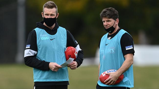 Harvey, right, has worked under Nathan Buckley at Collingwood since 2012. Picture: Quinn Rooney/Getty Images