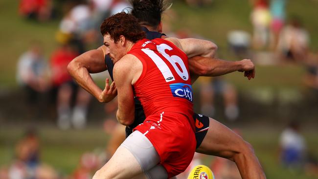 Sydney’s Gary Rohan lays a strong tackle on Stephen Coniglio. Picture: Getty Images