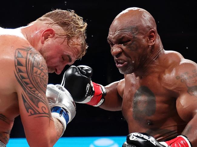 ARLINGTON, TEXAS - NOVEMBER 15: (L-R) Jake Paul and Mike Tyson fight during LIVE On Netflix: Jake Paul vs. Mike Tyson at AT&T Stadium on November 15, 2024 in Arlington, Texas. (Photo by Sarah Stier/Getty Images for Netflix Ã&#130;Â© 2024)