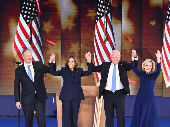 US Vice President and Democratic presidential candidate Kamala Harris (2L) onstage with Second Gentleman Douglas Emhoff, Minnesota Governor and Democratic vice presidential candidate Tim Walz and his wife Gwen Walz wave to the crowd at the end of the fourth and last day of the Democratic National Convention (DNC) at the United Center in Chicago, Illinois, on August 22, 2024. Vice President Kamala Harris formally accepted the partyâs nomination for president today at the DNC which ran from August 19-22 in Chicago. (Photo by MANDEL NGAN / AFP)