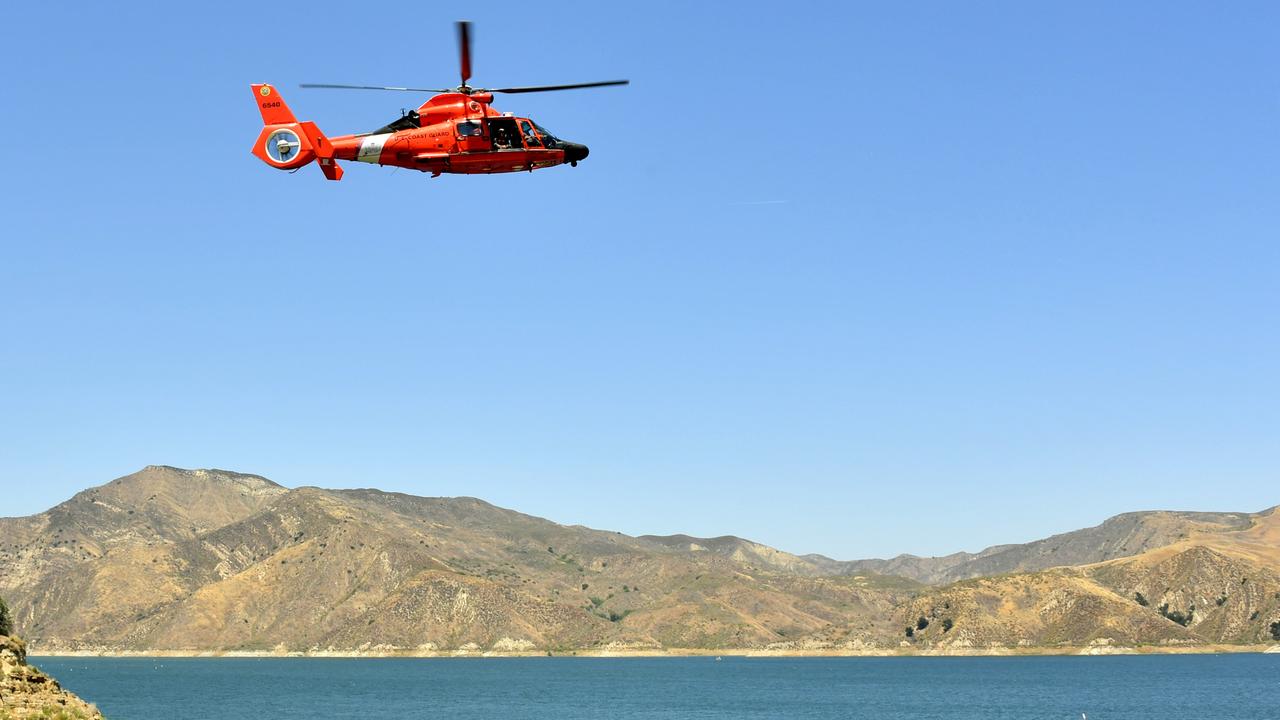 A US Coast Guard helicopter flies over Lake Piru, where actress Naya Rivera was reported missing on Wednesday. Picture: Getty Images.