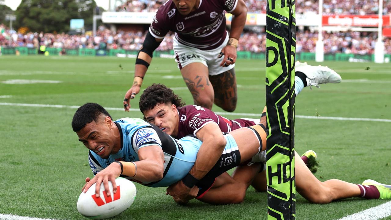 SYDNEY, AUSTRALIA - SEPTEMBER 08: Ronaldo Mulitalo of the Sharks scores a try during the round 27 NRL match between Manly Sea Eagles and Cronulla Sharks at 4 Pines Park, on September 08, 2024, in Sydney, Australia. (Photo by Cameron Spencer/Getty Images)