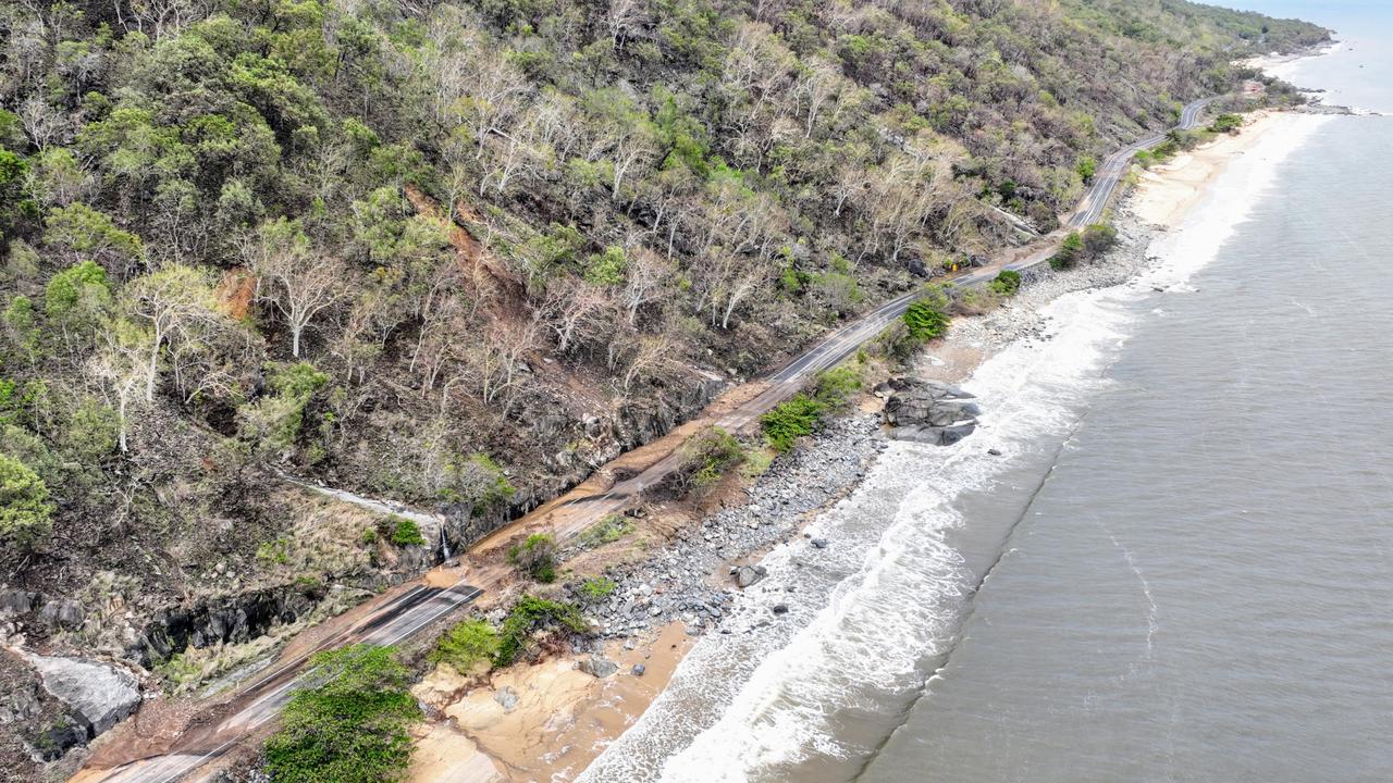 Ellis Beach has been smashed by landslides caused by flooding rain after ex Tropical Cyclone Jasper crossed the Far North Queensland coast. Mud, trees and rocks have caused large landslides across the Captain Cook Highway, which will take weeks to clean up and reopen. Picture: Brendan Radke