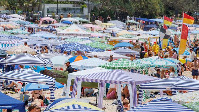 Crowds pack in to Noosa Main Beach on the New Years Day public holiday. Picture Lachie Millard