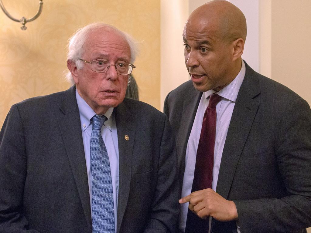 Sen. Bernie Sanders and Sen. Cory Booker (D-NJ) attends a press conference. Picture: Getty