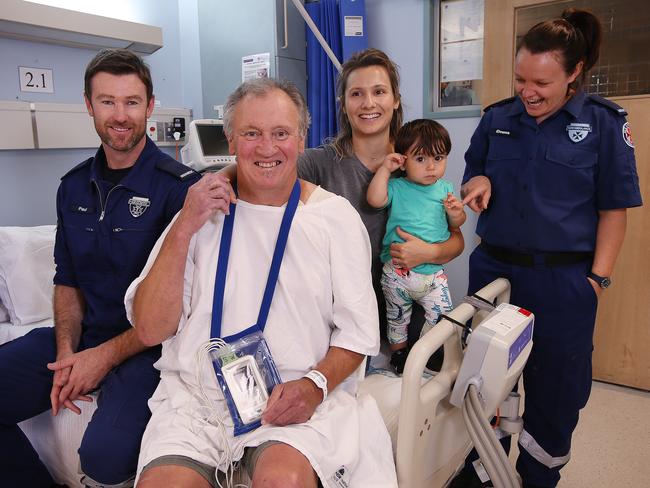 Mick Lukins at St George Hospital after having a heart attack. He was kept alive by family until paramedics arrived. From left: Paramedic Paul O'Grady, Mick, his daughter Elise Namini, grandson Rafael and paramedic Emma Bradley. Picture: Sam Ruttyn