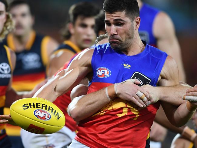 ADELAIDE, AUSTRALIA - MAY 14: Marcus Adams of the Lions tackled by Rory Laird of the Crows during the round nine AFL match between the Adelaide Crows and the Brisbane Lions at Adelaide Oval on May 14, 2022 in Adelaide, Australia. (Photo by Mark Brake/Getty Images)