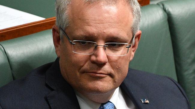 On the plus side, when Scott Morrison wears his flag upside down, it looks the right way up when he looks down at it. Picture: AAP