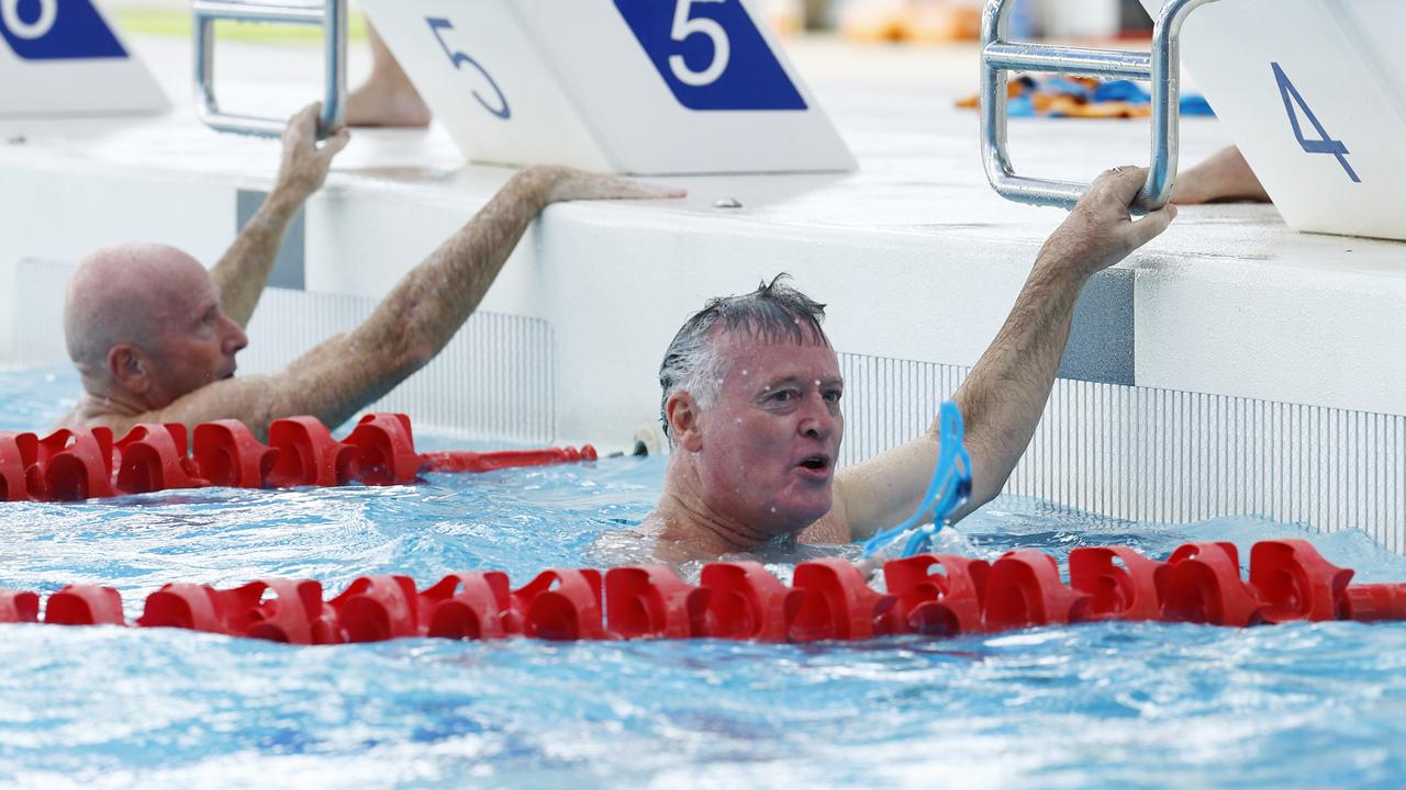 Cairns MP Michael Healy completes his swim leg in the inaugural CLAMS charity swim relay at Tobruk Memorial Pool, raising money for the Far North Queensland Hospital Foundation. The Sports Minister has responded to criticism around the Brisbane 2032 Olympics. Picture: Brendan Radke