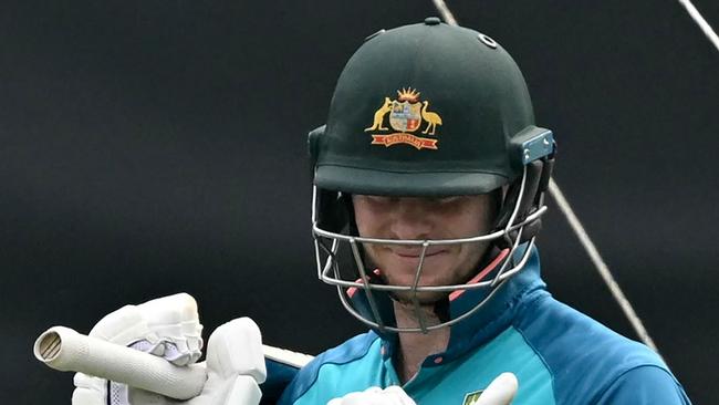 Australia's Steve Smith looks at his gloves during a practice session on the eve of their 2023 ICC Men's Cricket World Cup one-day international (ODI) match against Afghanistan at the Wankhede Stadium in Mumbai on November 6, 2023. (Photo by Indranil MUKHERJEE / AFP) / -- IMAGE RESTRICTED TO EDITORIAL USE - STRICTLY NO COMMERCIAL USE --