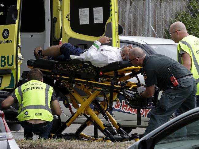 Ambulance staff take a man from outside a mosque in central Christchurch, New Zealand. Picture: AP