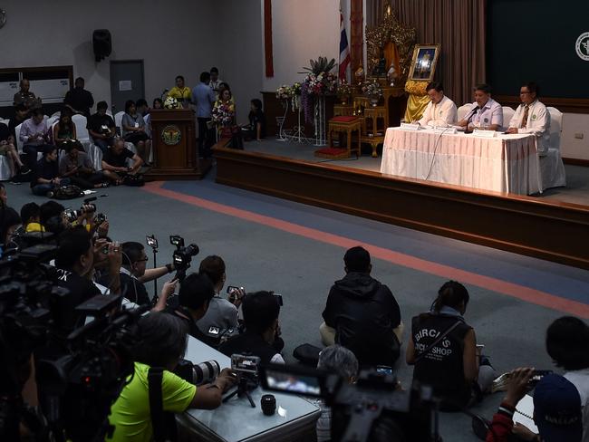 Thai health officials Thongchai Lertwilairattanapong (l), Dr Jesada Chokedamrongsuk (c) and Dr Chaiwet Thanapaisan (r) brief the media about the condition of the eight boys in hospital. Picture: AFP/Lillian Suwanrumpha