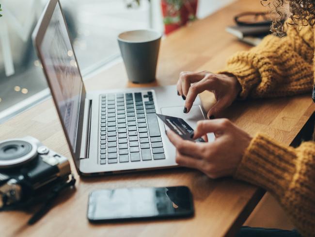 Woman in cafe shopping online with laptopcredit: istockESCAPEsavvy21 february 2021