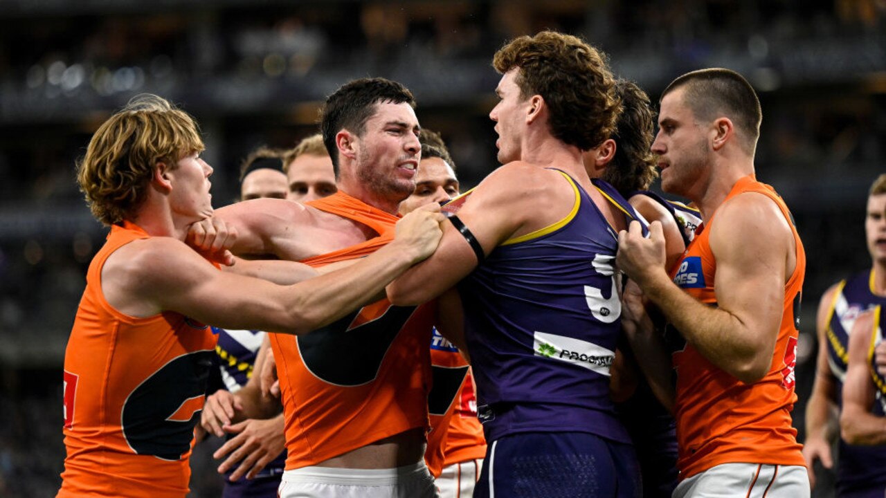 PERTH, AUSTRALIA - APRIL 09: Lachie Ash of the Giants wrestles with Blake Acres of the Dockers during the 2022 AFL Round 04 match between the Fremantle Dockers and the GWS Giants at Optus Stadium on April 09, 2022 In Perth, Australia. (Photo by Daniel Carson/AFL Photos via Getty Images)