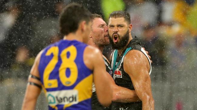 Paddy Ryder celebrates one of Port’s 13 goals in front of the forlorn Eagles. Picture: AAP