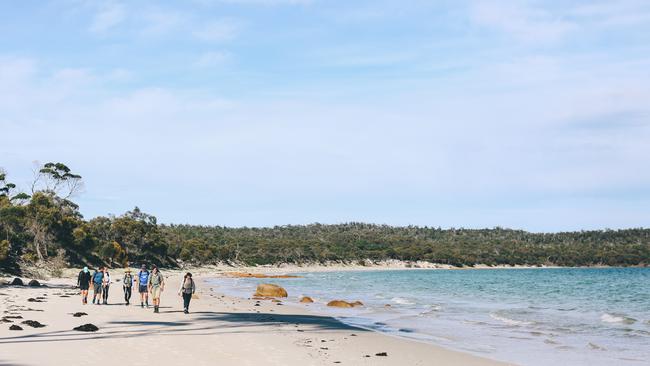 Strolling along Cooks Beach on the Freycinet Experience Walk in Tasmania.