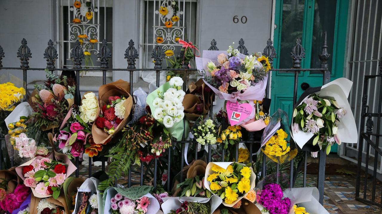 Floral tributes decorated Mr Baird’s house following news of their alleged murders. Picture: NCA NewsWire / Gaye Gerard