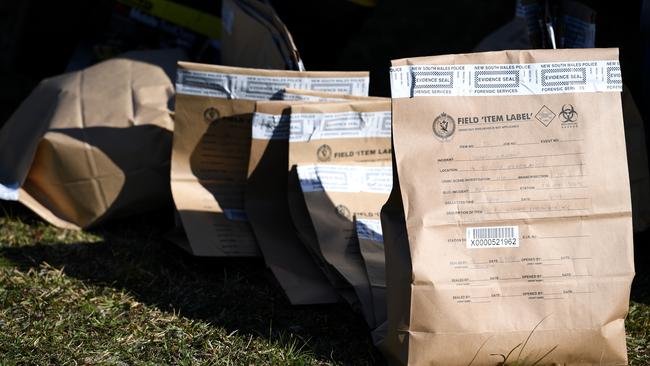 Police evidence bags await processing after the raid.