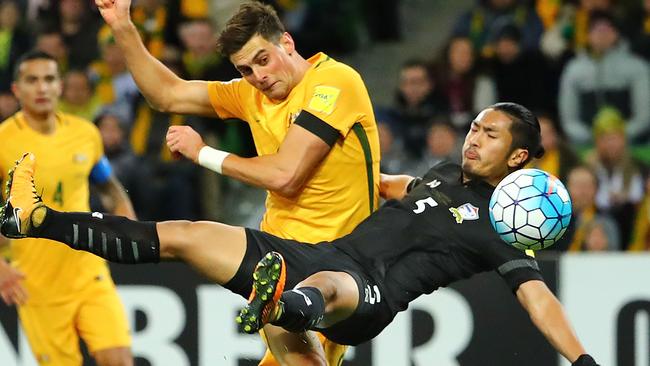 Socceroos striker Tomi Juric has his shot deflected by Thai defender Adison Promrak on Tuesday night.