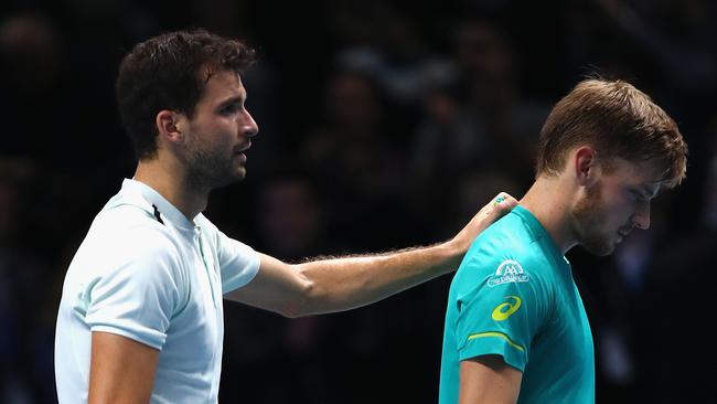 Grigor Dimitrov consoles David Goffin after the final.