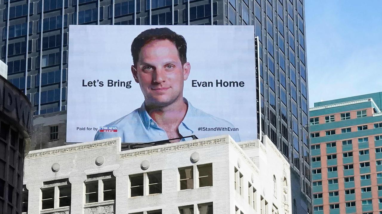 An electronic billboard at New York's Times Square marks the one year anniversary of the imprisonment in Russia of Wall Street Journal reporter Evan Gershkovich, on March 29, 2024. (Photo by TIMOTHY A. CLARY / AFP)