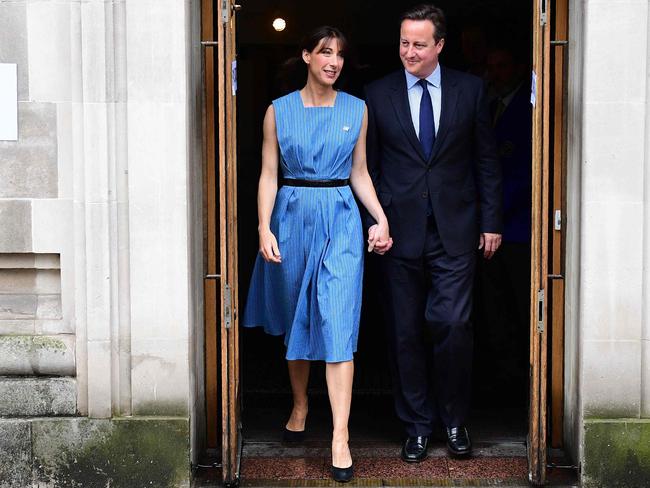 TOPSHOT - British Prime Minister David Cameron and his wife Samantha leave after casting their votes in the EU referendum, at a polling station in London on June 23, 2016. Millions of Britons began voting Thursday in a bitterly-fought, knife-edge referendum that could tear up the island nation's EU membership and spark the greatest emergency of the bloc's 60-year history. / AFP PHOTO / LEON NEAL