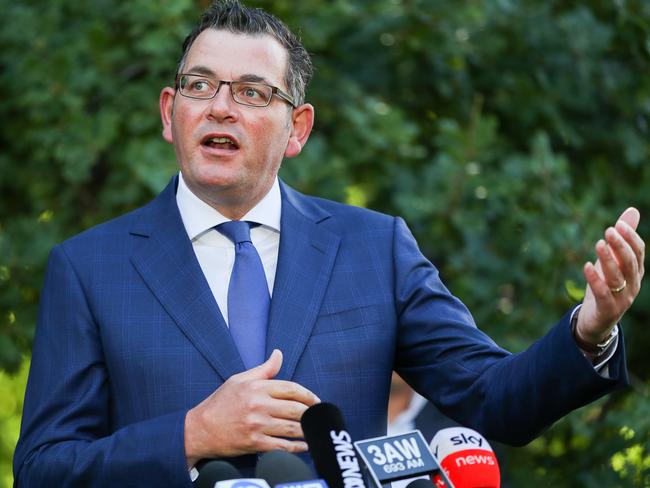 MELBOURNE, AUSTRALIA - FEBRUARY 04: Premier of Victoria Daniel Andrews speaks and makes a gesture during a Press conference at Victorian Parliament House on February 04, 2021 in Melbourne, Australia. Victoria has reintroduced COVID-19 restrictions after a hotel quarantine worker tested positive for coronavirus on Wednesday. The positive case was from one of the Australian Open quarantine hotels, with some 600 Australian Open players, officials and support staff told to isolate and get tested. All tennis matches at Melbourne Park on Thursday have been called off. Masks are now mandatory indoors across Victoria with gatherings now limited to 15 people in a household while the 75 percent return to work plan, scheduled to begin on Monda has been paused. (Photo by Asanka Ratnayake/Getty Images)