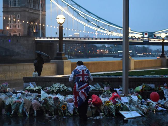 A man stands in lone vigil after the terror attack on London Bridge. Picture: AFP/Chris J Ratcliffe