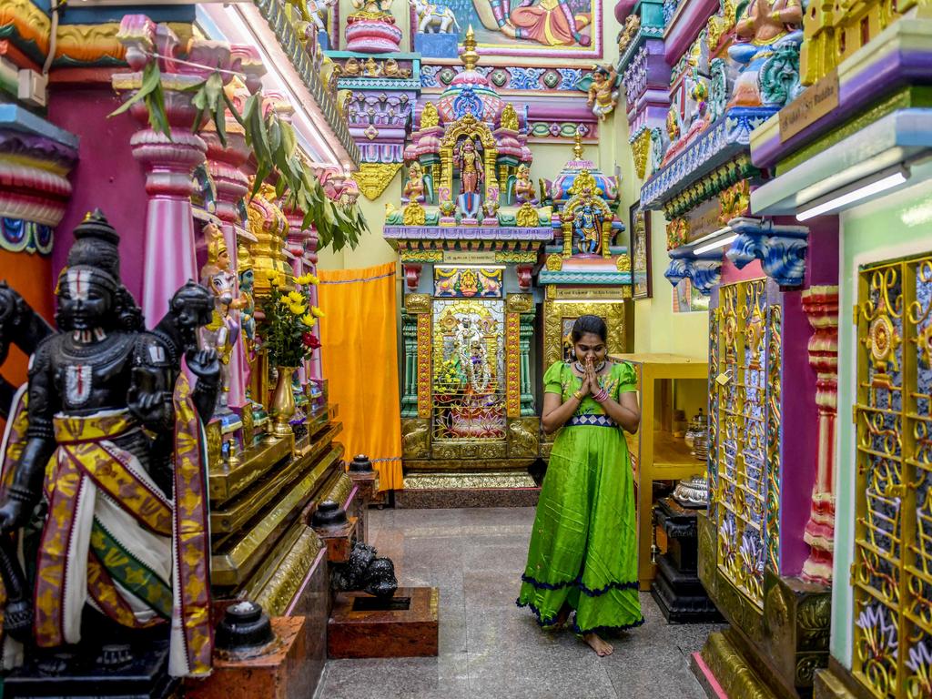 A woman prays during Diwali at a temple in Yangon on October 31. Picture: Sai Aung Main/ AFP