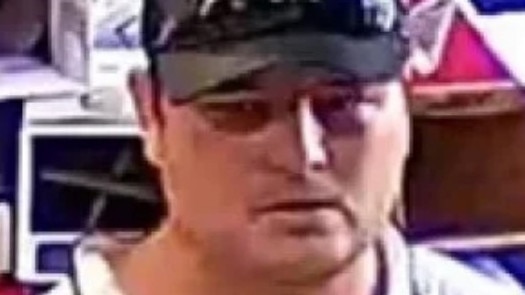 Do you know this man? Police allege he can assist investigations into who stole alcohol from a bottle shop and told staff he had a gun in the afternoon on Australia Day.