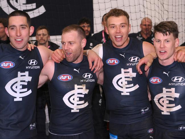 MELBOURNE, AUSTRALIA - SEPTEMBER 08: Jacob Weitering, Sam Docherty, Patrick Cripps, Sam Walsh and Tom De Koning of the Blues sings the song in the rooms after winning  the First Elimination Final AFL match between Carlton Blues and Sydney Swans at Melbourne Cricket Ground, on September 08, 2023, in Melbourne, Australia. (Photo by Quinn Rooney/Getty Images)