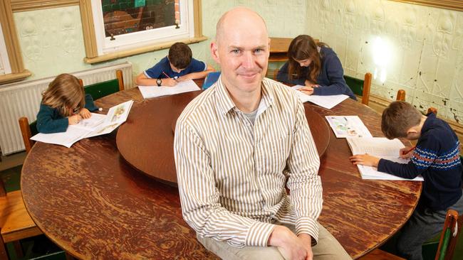 Students are returning to physical attendance at Fitzroy Community School during the COVID-19 pandemic. Principal Tim Berryman with his children L to R Abigaelle, 6, Christian, 10, Charlotte, 12, and Xavier, 8. Picture: Mark Stewart.