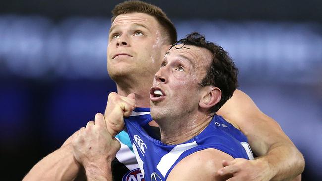 Todd Goldstein of the Kangaroos battles with Peter Ladhams of the Power in the ruck. Picture: Michael Klein