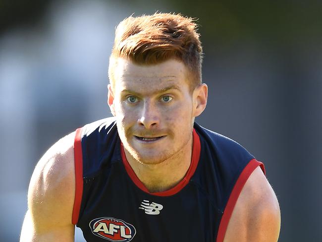 MELBOURNE, AUSTRALIA - MAY 14: Oskar Baker of the Demons handballs during a Melbourne Demons AFL training session at Gosch's Paddock on May 14, 2019 in Melbourne, Australia. (Photo by Quinn Rooney/Getty Images)