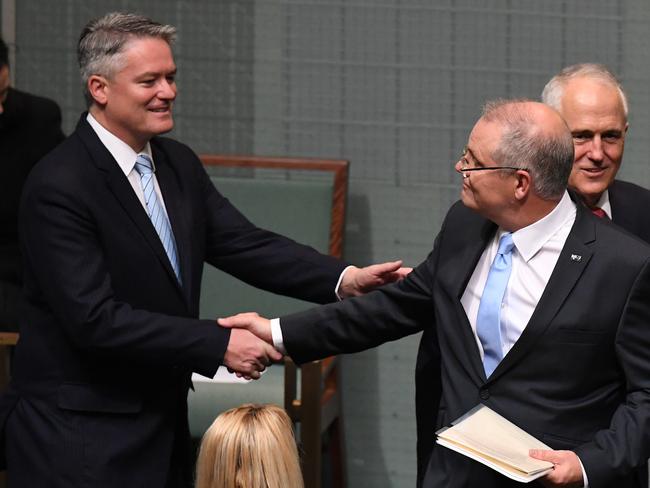 Federal Treasurer Scott Morrison shakes hands with Minister for Finance Mathias Cormann prior to handing down his third Federal Budget. Picture: AAP