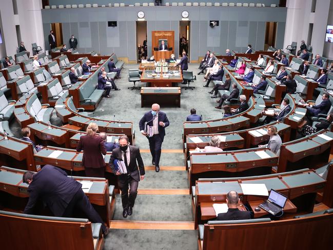 Australian Prime Minister Scott Morrison wears a mask as he walks out of the House of Representatives at Parliament House. Picture: Getty
