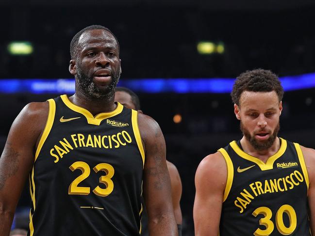 MEMPHIS, TENNESSEE - JANUARY 15: Draymond Green #23 of the Golden State Warriors and Stephen Curry #30 of the Golden State Warriors walk off the court during the first half against the Memphis Grizzlies at FedExForum on January 15, 2024 in Memphis, Tennessee. NOTE TO USER: User expressly acknowledges and agrees that, by downloading and or using this photograph, User is consenting to the terms and conditions of the Getty Images License Agreement. (Photo by Justin Ford/Getty Images)