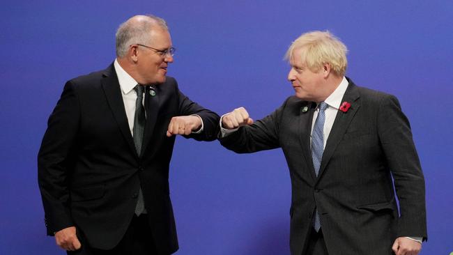 Boris Johnson greets Scott Morrison as they arrive to attend the COP26 UN Climate Change Conference in Glasgow. Picture: AFP