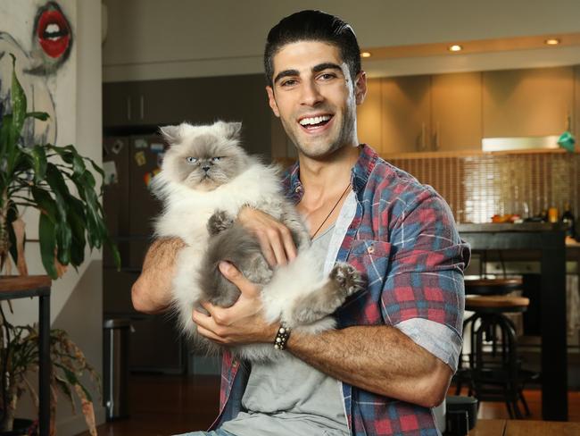 My Kitchen Rules contestant Ibby Moubadder with his cat Belle. Picture: Richard Dobson