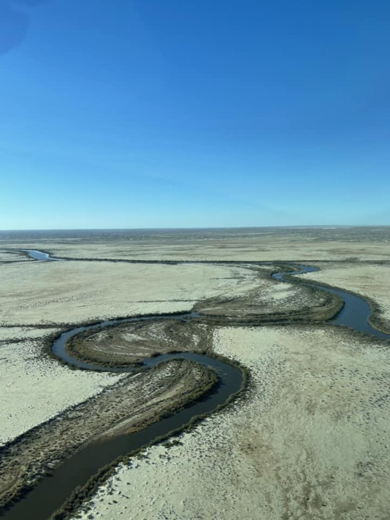 Flood waters travel through Channel Country in the far northeast of South Australia heading towards Lake Eyre. Picture: Wrights Air