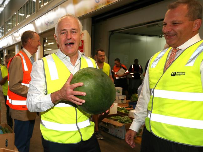 Federal Election 2016 9/5/16: Day 2 of the campaign, PM Malcolm Turnbull with a watermelon next to candidate Nic Monsour (Campbell Newmans brother in law) and meets local fruit and veggie workers as he visits the Brisbane Produce Markets in the Federal seat of Morton , in Rocklea south of Brisbane. Pic Lyndon Mechielsen/News Corp.