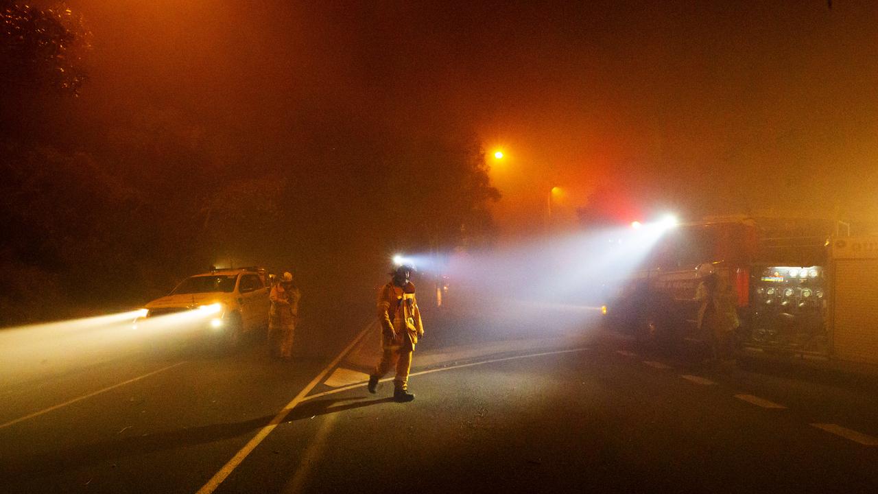 Fire and Rescue teams fight a wild bushfire as it approaches Peregian Beach township on David Low Way. Photo Lachie Millard