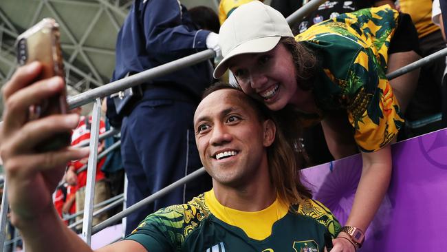 OITA, JAPAN - OCTOBER 05: Christian Lealiifano of Australia poses for a selfie with fans after the Rugby World Cup 2019 Group D game between Australia and Uruguay at Oita Stadium on October 05, 2019 in Oita, Japan. (Photo by Dan Mullan/Getty Images)