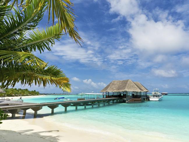 footbridge connecting with the thatched jetty in maldives island resort Picture: Istock