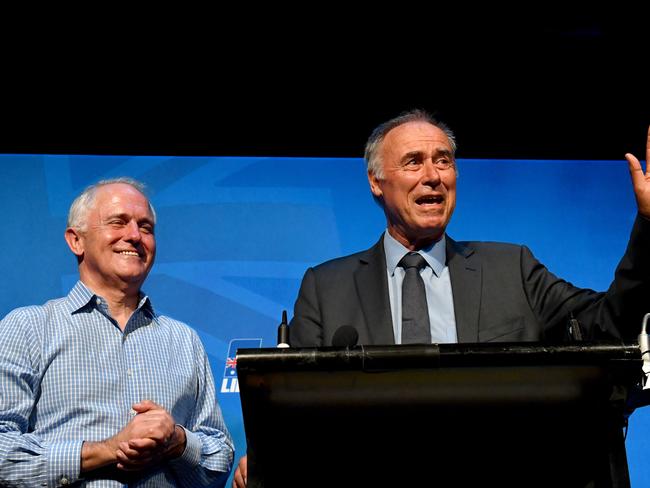 Prime Minister Malcolm Turnbull and newly elected Liberal member for Bennelong John Alexander celebrate.