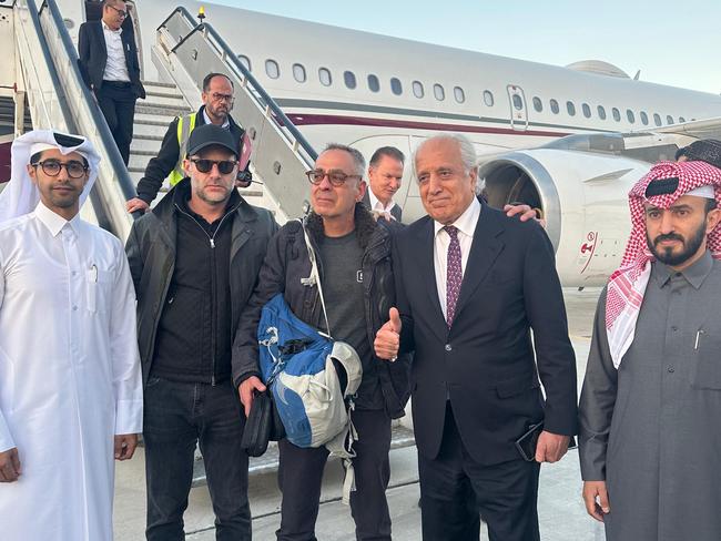 US citizen George Glezmann (C) posing for a picture with US official Adam Boehler (C-L), former US envoy to Afghanistan Zalmay Khalilzad (C-R) and Qatari diplomats in Kabul on March 20, 2025, ahead of their departure to Doha. Picture: AFP