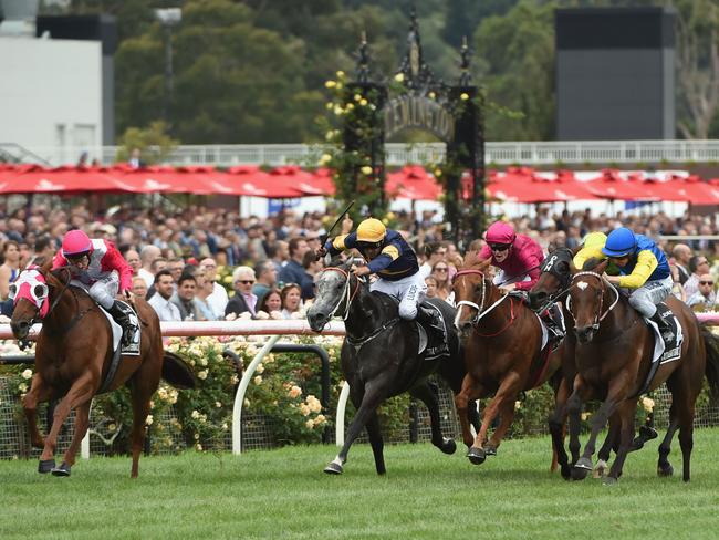 The Quarterback (far left) gets the better of Chautauqua and Black Heart Bart to win the Group 1 Newmarket Handicap last month. Picture: Getty Images