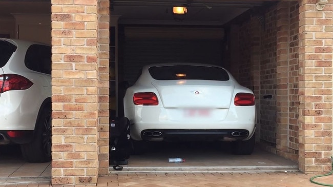 Some of the cars at one of the properties cops raided. Picture: Supplied