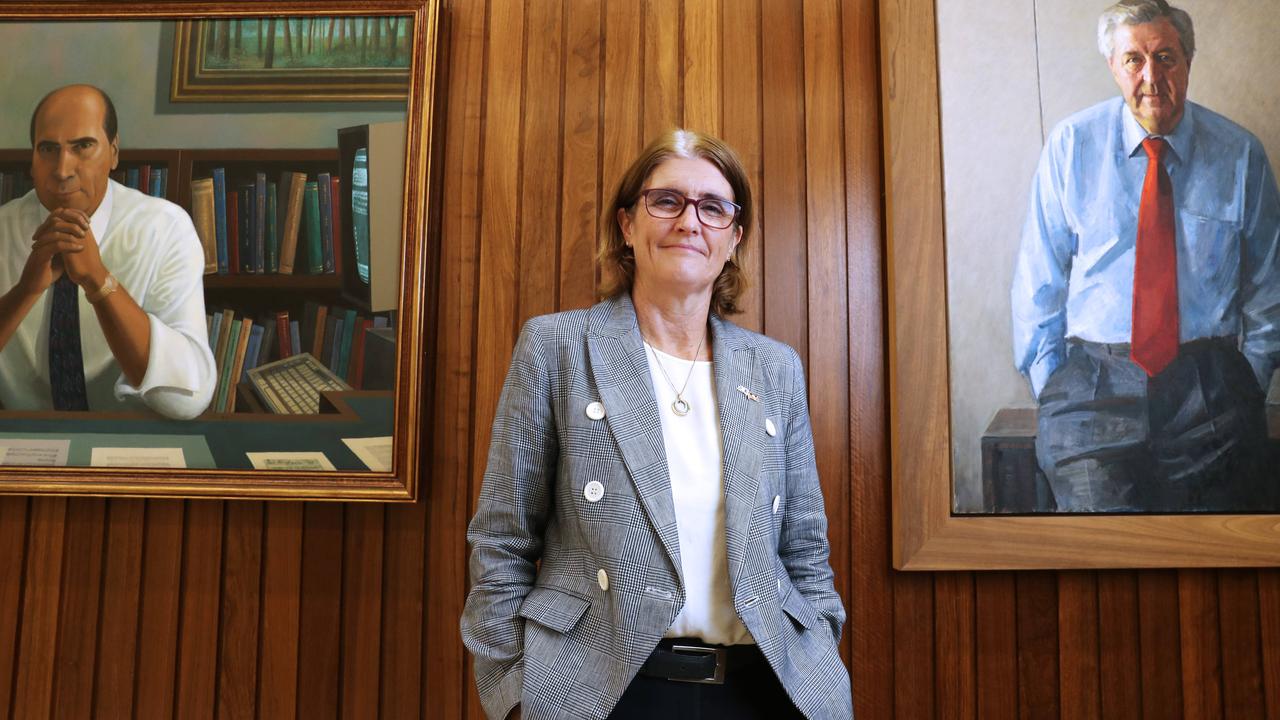 Incoming RBA Governor Michelle Bullock standing under the portraits of two former central bank governors, Bernie Fraser (left) and Ian Macfarlane (right) at the RBA offices in Martin Place on Friday. Picture: John Feder for The Australian.